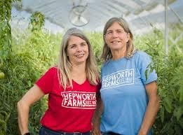 Amy and Gail Hepworth standing in a greenhouse, representing women-owned cannabis cultivation supporting Queens dispensaries