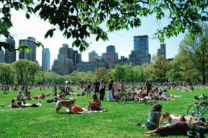 New York City, USA - May 11, 2014: New Yorkers hanging out in central park on a sunny weekend