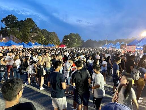 Vendors and crowds at the Queens Night Market as Summer Things-to-do