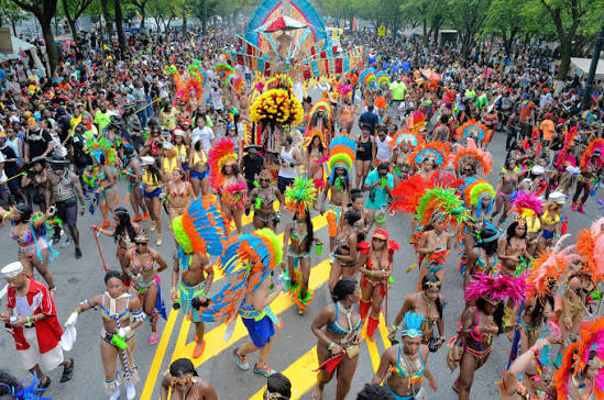 Masquerade costumes and crowds at the West Indian Day Parade in Brooklyn