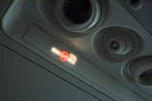 Non Smoking Area Sign on the Airplane. Smoking on the Air is Prohibited.