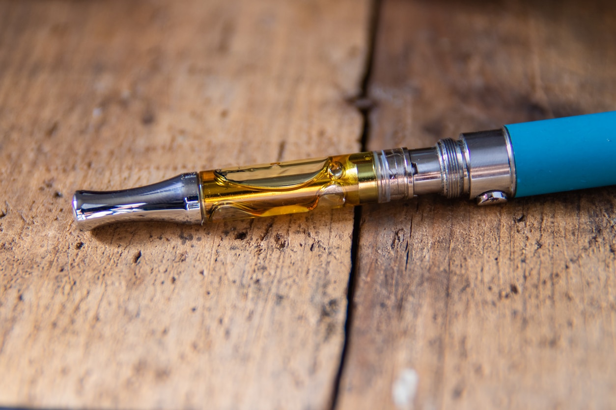 THC/CBD oil filled into cartridge attached to a battery to heat up and smoke the cannabis oil.